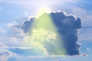 Image showing beam of sun fighting through the shaped cloud