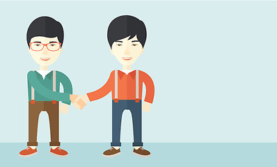 Image showing Two asian guys happily handshaking.