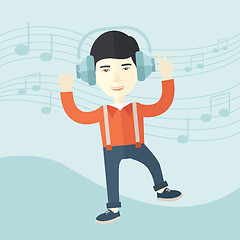 Image showing Happy young man dancing while listening to music.