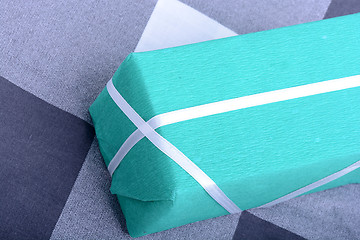 Image showing Green gift box with white ribbon