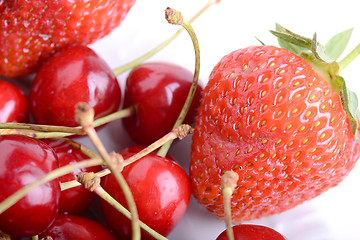 Image showing Sweet cherries and strawberries close up