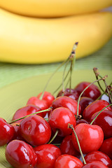 Image showing Close up of a fresh pile of fruit consisting of cherries and bananas