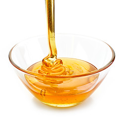 Image showing honey pouring into bowl