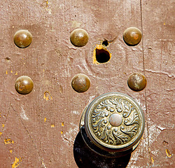 Image showing knocker and brown rusty wood