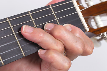 Image showing Old hand and guitar isolated