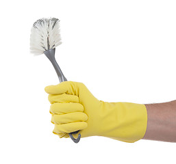 Image showing Protection glove holding a dish-brush