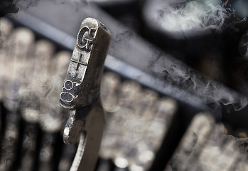 Image showing G hammer - old manual typewriter - mystery smoke