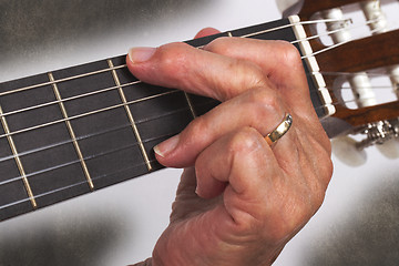 Image showing Old hand and guitar isolated