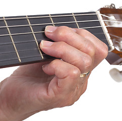 Image showing Old hand and guitar isolated