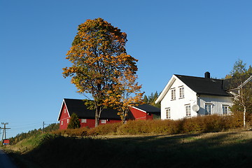 Image showing Farmhouse, tree with autumn leaves