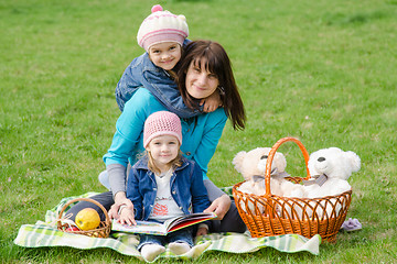 Image showing Mother and two daughters on a picnic