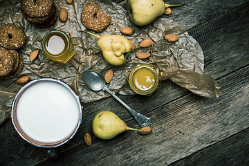 Image showing Almonds pears Cookies and cream on rustic wood