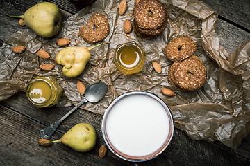 Image showing pears Cookies and sour cream on wooden table