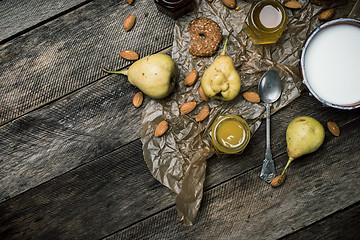 Image showing pears Cookies and yoghurt on wooden table