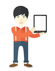 Image showing Asian guy holding a digital tablet. 