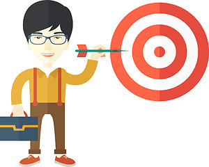 Image showing Working chinese man holding a target arrow 