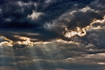 Image showing Stormy sky with a dramatic sunbeams