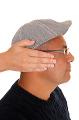 Image showing Woman cover the ear\'s of her man.