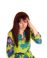Image showing Crying woman with bad headache.