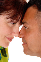 Image showing Middle age couple with forehead together.