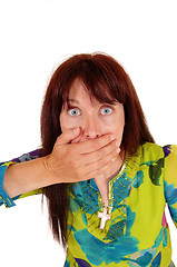 Image showing Surprised woman with hand on mouth.