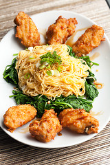 Image showing Chicken Wings with Noodles and Spinach