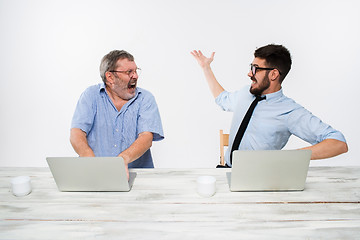 Image showing The two colleagues working together at office on white background