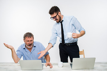 Image showing The two colleagues working together at office on white background