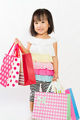 Image showing Asian Kid with shopping bag