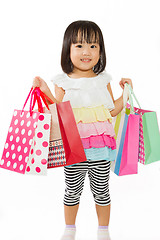 Image showing Asian Kid with shopping bag