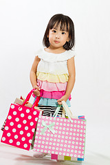 Image showing Asian Kid with shopping bag