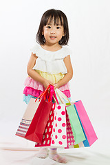 Image showing Asian Kid with shopping bag
