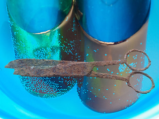 Image showing Rusted scissors and bottles