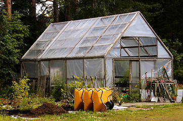 Image showing winter garden, wheelbarrows and garden equipment