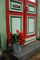 Image showing door, mailbox and a bucket of flowers