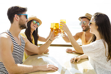 Image showing Friends drinking a cold beer