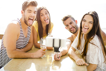 Image showing Group selfie at the beach bar