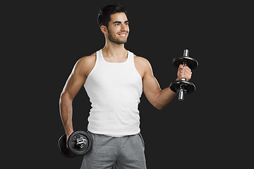 Image showing Athletic man lifting weights