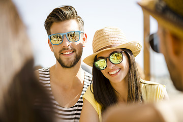 Image showing Friends at the beach bar