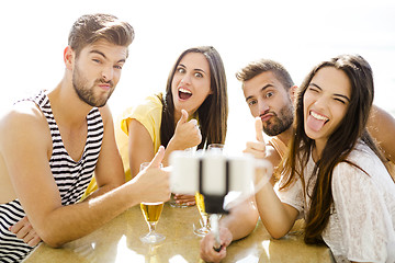 Image showing Group selfie at the beach bar