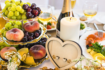 Image showing Wedding table with candle and heart-shaped decoration