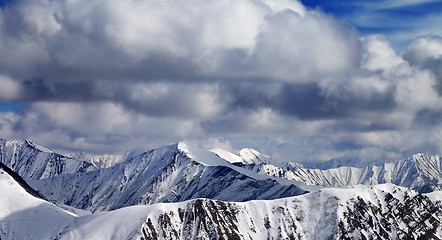 Image showing Winter sunlight mountains in clouds