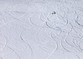 Image showing Snowboarder downhill on off piste slope with newly-fallen snow