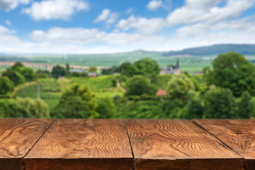 Image showing wooden table with vineyard landscape