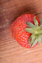 Image showing Strawberry on wooden plate close up