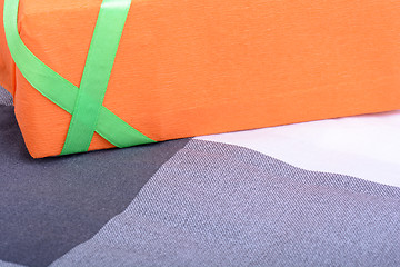 Image showing orange gift box with green ribbon