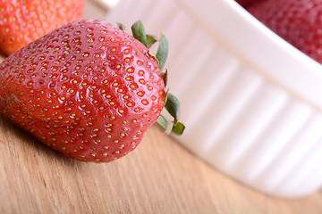 Image showing Close up strawberry on wooden plate