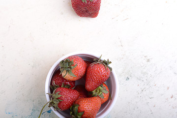 Image showing Close up strawberry on old watercolor plate