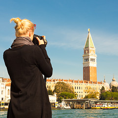 Image showing Female tourist taking photo of Venice.