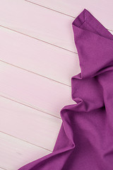 Image showing Purple towel over wooden table